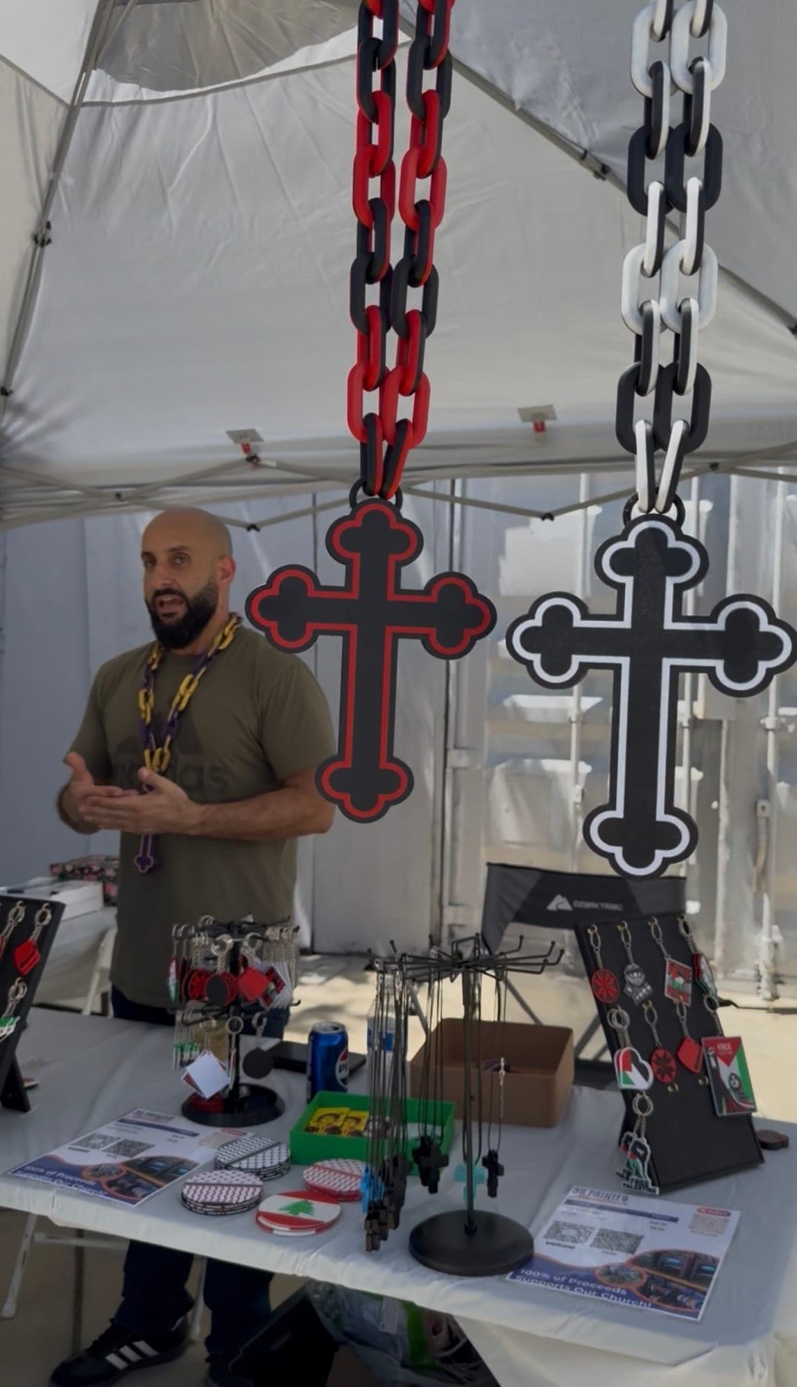 Handmade crosses on chains at a vendor table