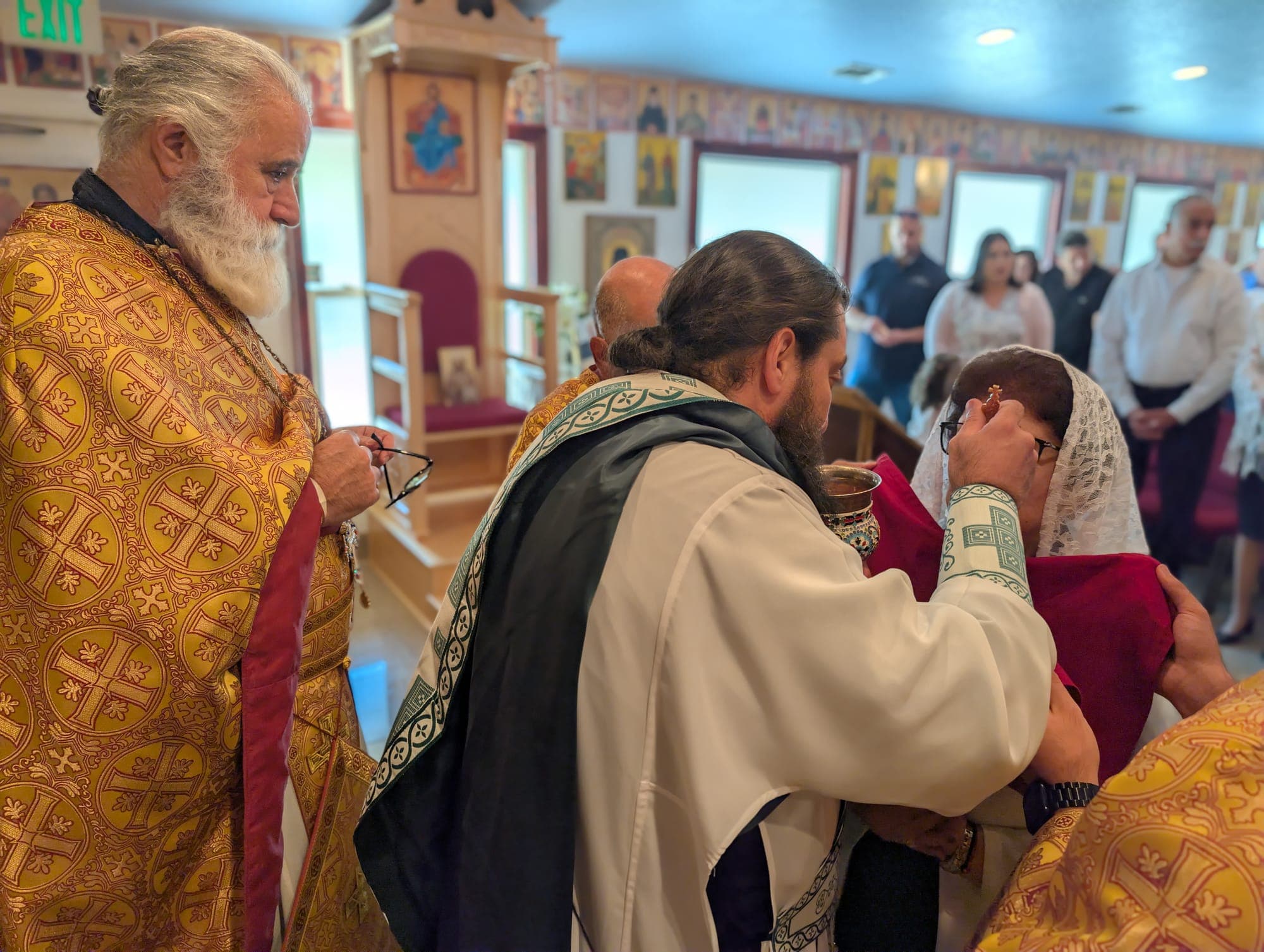 The faithful receiving Holy Communion